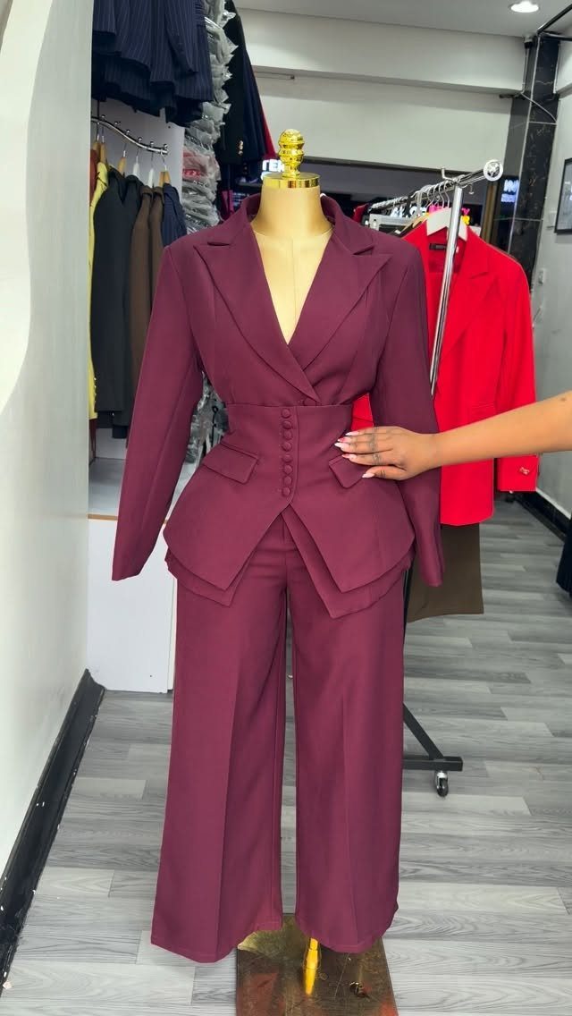 A maroon tailored blazer and wide-leg trousers displayed on a mannequin.