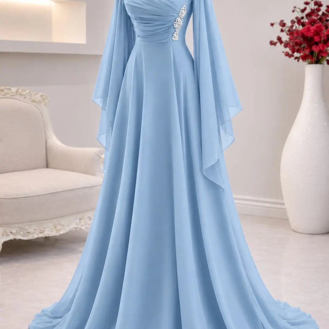 Light blue chiffon gown with pleated bodice and flowing cape sleeves in a bright room.