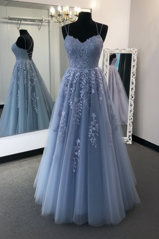A light blue floor-length prom dress with floral lace details on a mannequin.
